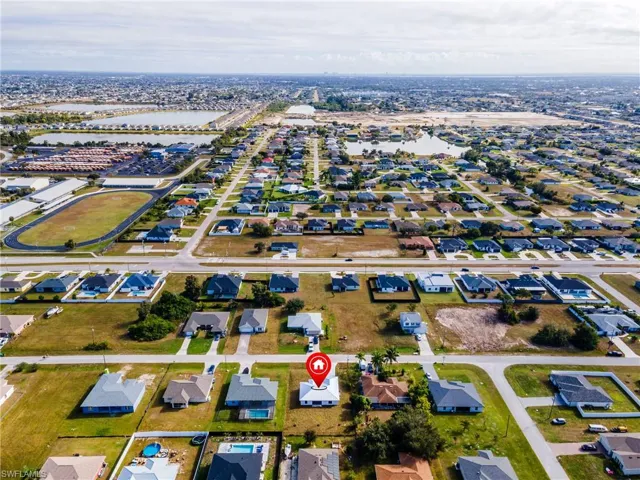 View of property location with nearby suburban area and a large body of water