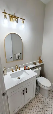 Bathroom with vanity and toilet