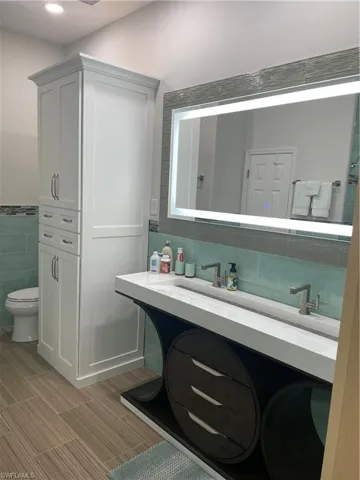 Custom Vanity and Mirror In Owners suite