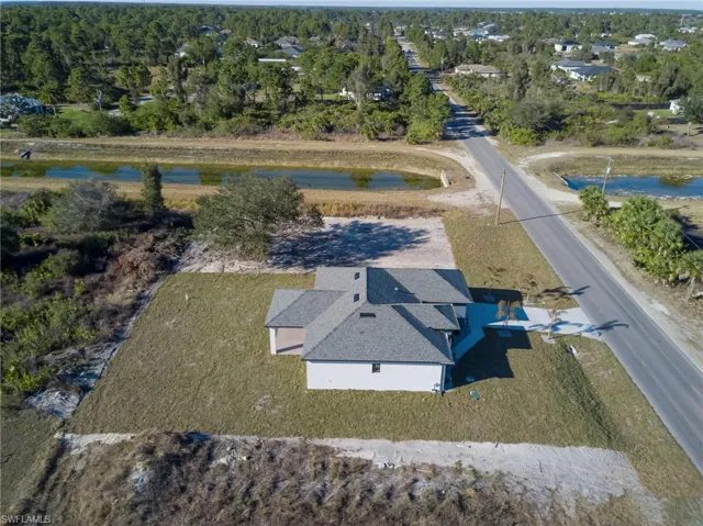 View from above of property with a nearby body of water