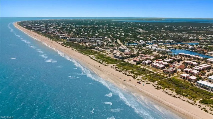 Bird's eye view of waterfront with a beach
