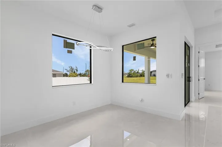 Tiled empty room with a wealth of natural light
