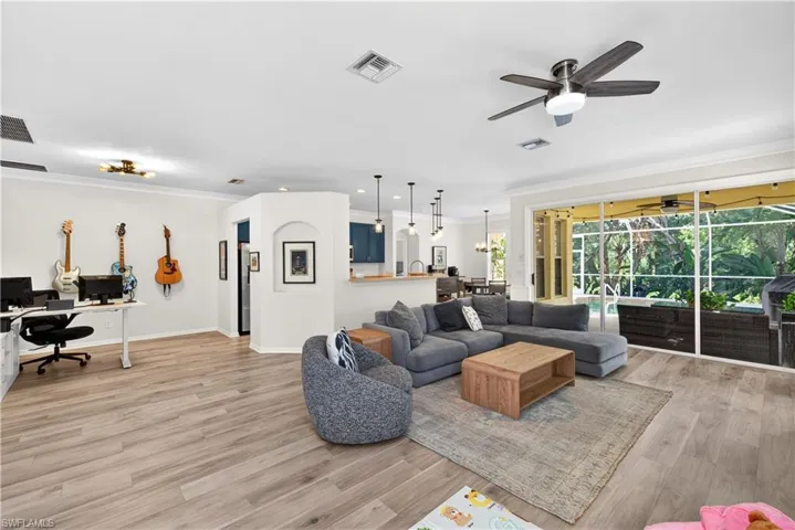 Lovely, spacious living room with sliders to beautiful lanai area