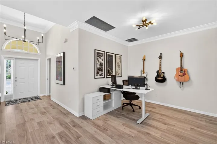 Spacious dining room with beautiful vinyl tile flooring (currently being used as office space)