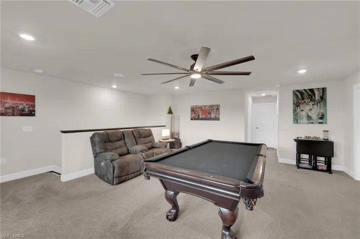 Rec room with billiards table, light colored carpet, recessed lighting, and ceiling fan
