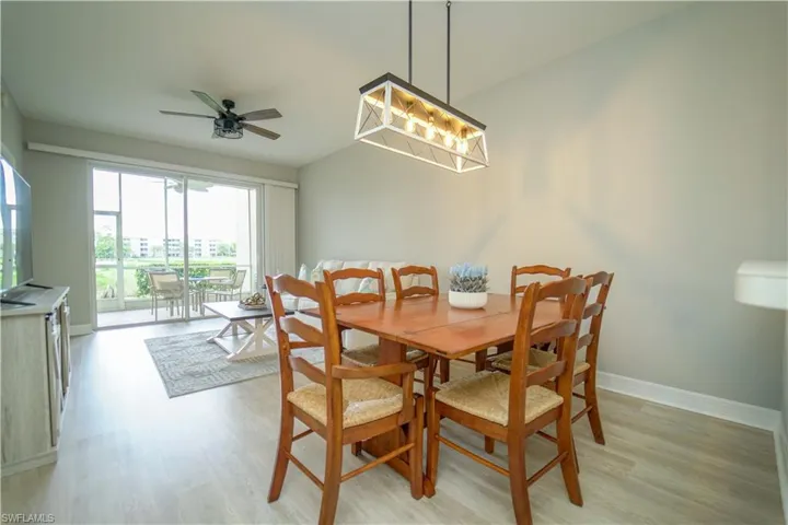 Dining space featuring light wood finished floors and ceiling fan