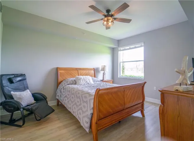 Bedroom featuring light wood-style floors and a ceiling fan