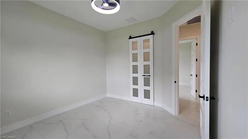 Spare room # 2 featuring barn closet door