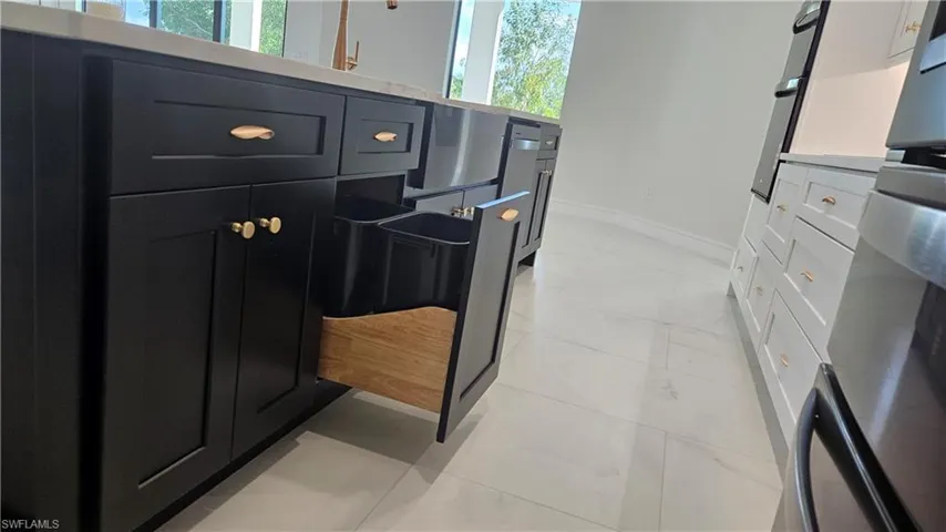 Trash/recycle cans pull out cabinet