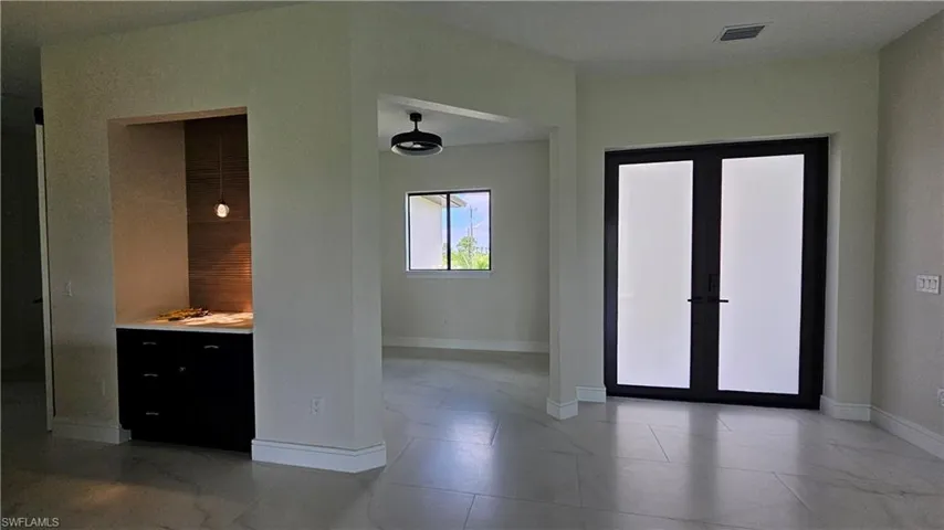 Coffee bar, Den entryway and front french doors