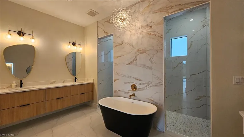 Bathroom with double floating wood color vanity