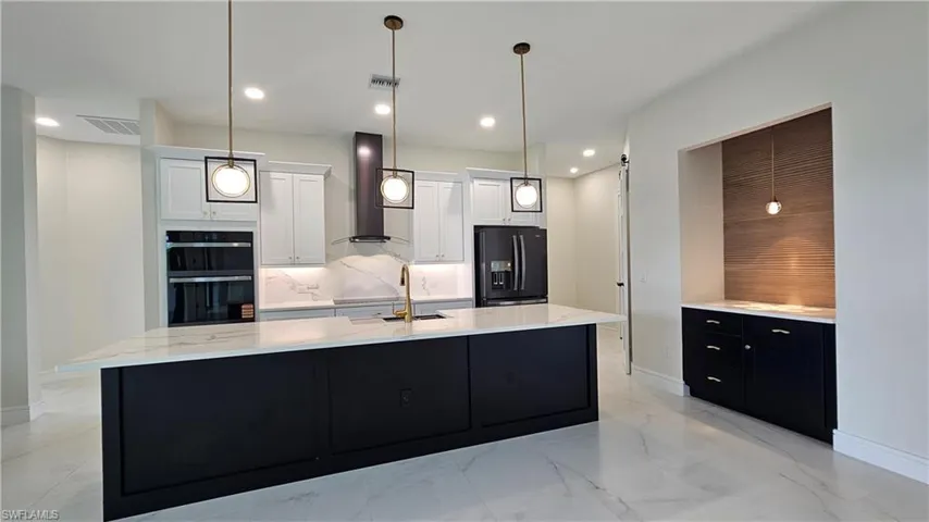 Kitchen featuring pendant lighting, and recessed lighting