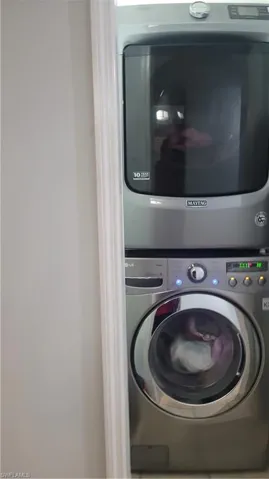 Washroom with stacked washer / dryer