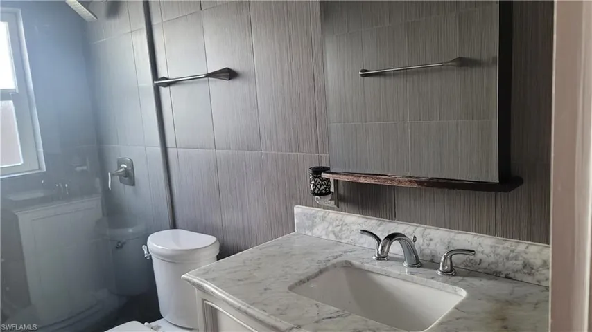 Bathroom featuring vanity and walk in shower