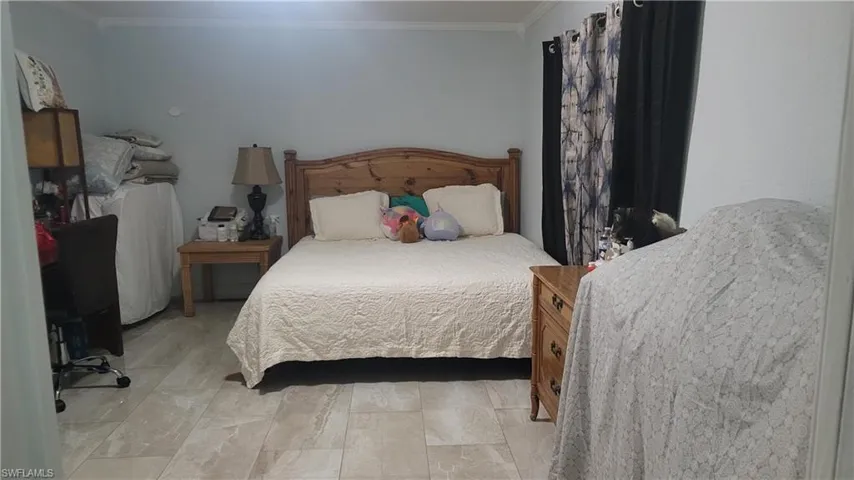 Bedroom with ornamental molding