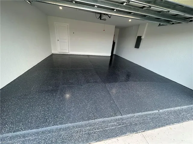 Garage featuring a garage door opener
