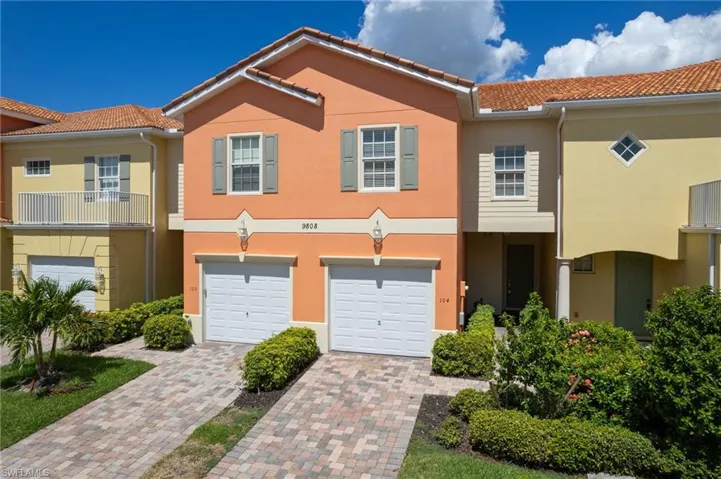 View of front of property with private entry and a garage