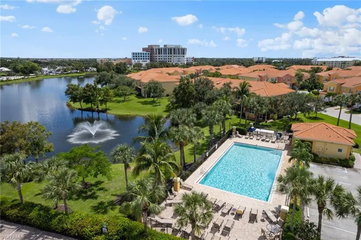 View of pool with a water view