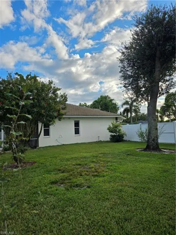 View of side of property with stucco siding