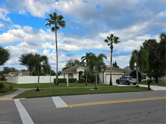 View of front of property with an attached garage and driveway