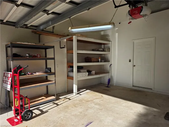 Garage featuring a garage door opener