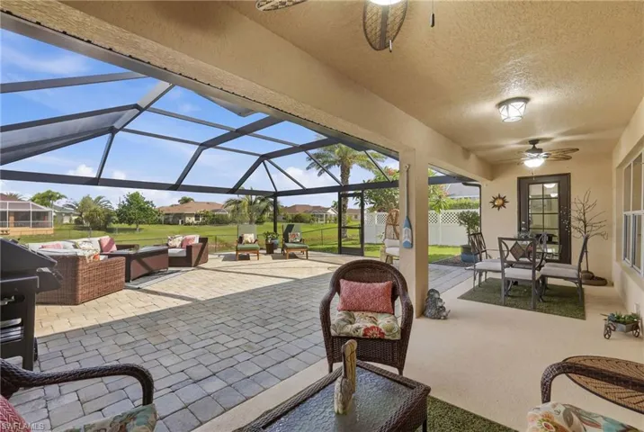 Expansive screened lanai featuring a paver patio and ample covered space