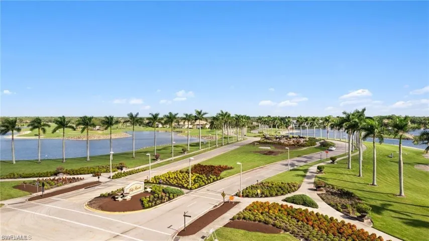 View of home's community featuring a lawn and a water view
