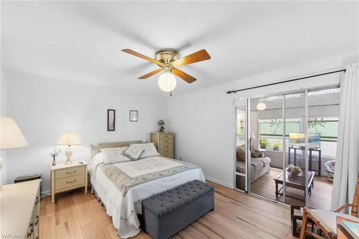 Master bedroom with ensuite bathroom and sliders that access the wrap around Florida room.