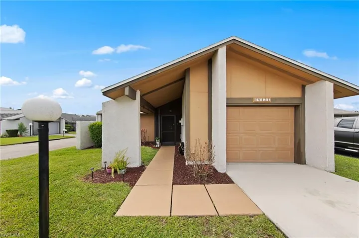Front view with beautiful landscaping and a roof installed in 2018.