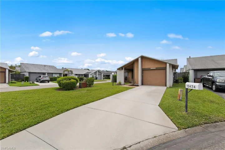 Front view with beautiful landscaping and a roof installed in 2018.