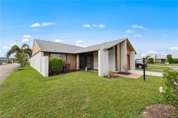 Front view with beautiful landscaping and a roof installed in 2018.