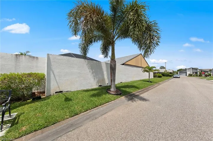 Privacy wall to the right of the home.