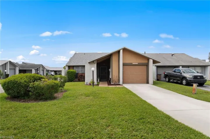 Front view with beautiful landscaping and a roof installed in 2018.