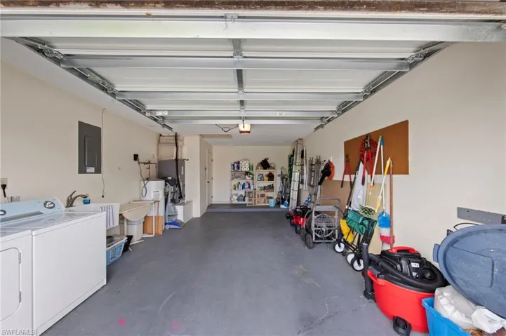 Garage with utility wash tub and washer and dryer included.