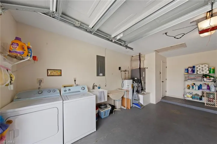Garage with utility wash tub and washer and dryer included.