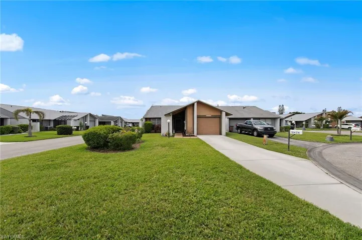 Front view with beautiful landscaping and a roof installed in 2018.