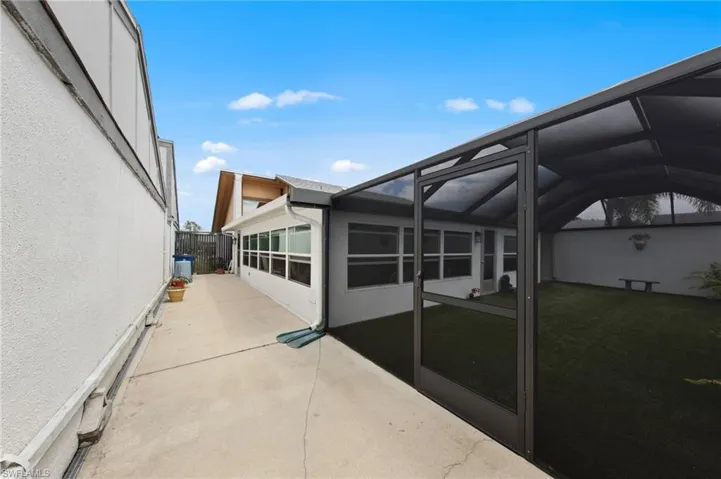The private backyard is fully enclosed with a courtyard-style privacy wall and features southern rear exposure for ideal sunlight throughout the day.
