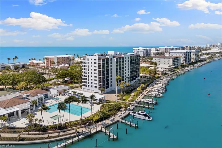 View of urban area featuring a marina and a large body of water