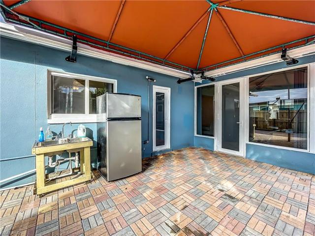 Outside refrigerator does not convey with the sale of this property.