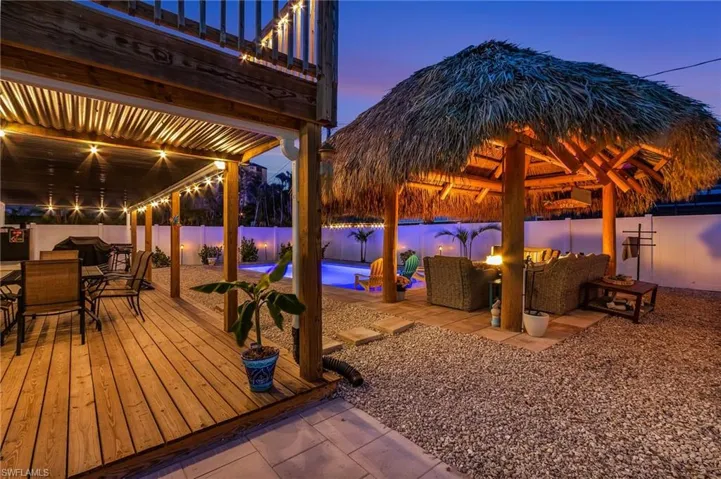 View of patio / terrace with an outdoor living space, a fenced in pool, a fenced backyard, a balcony, and outdoor dining space