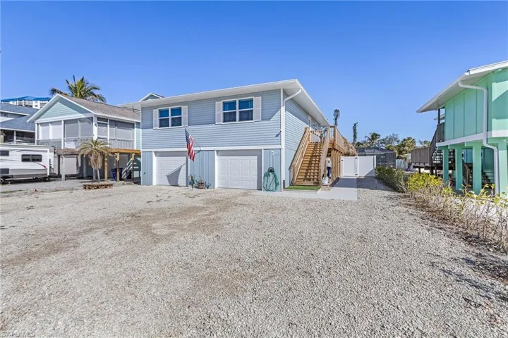 View of front of home with a two bay garag.e
