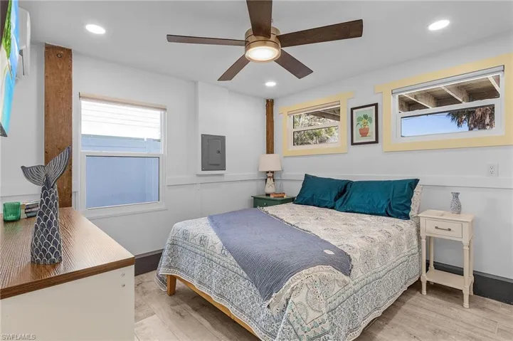 Guest quarters Bedroom with ceiling fan and lots of natural light.