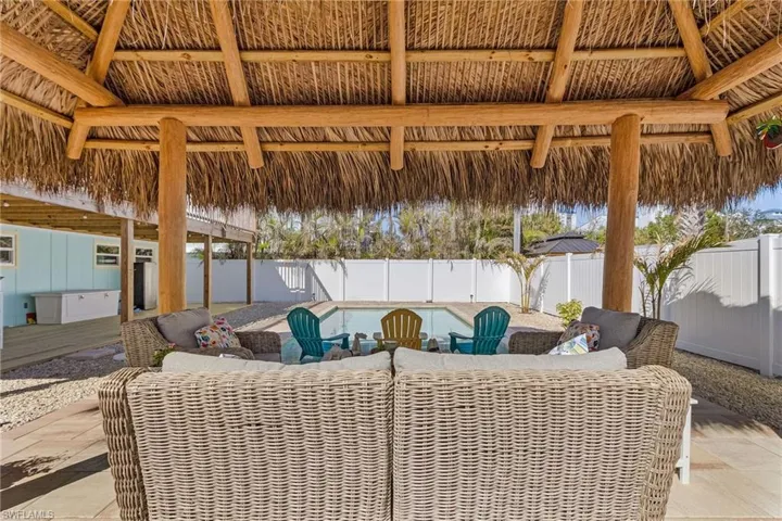View of patio / terrace with a gazebo and a fenced in pool.