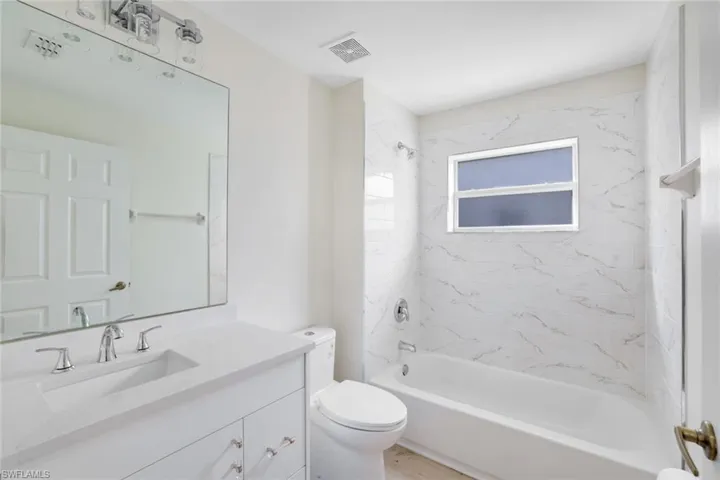 Full bathroom featuring vanity and shower / tub combination