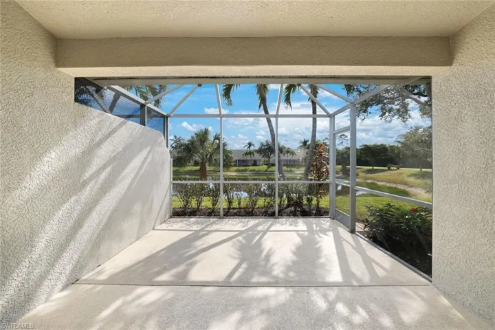 Unfurnished sunroom with a water view