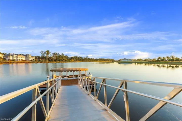 Dock area featuring a water view