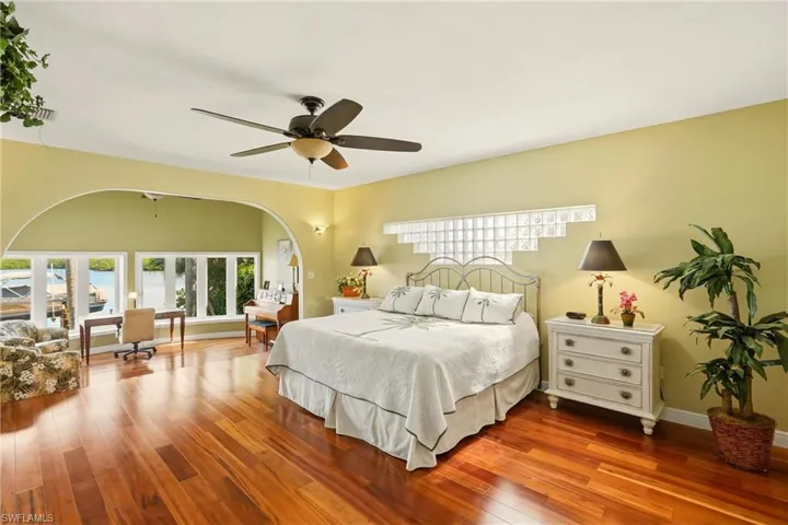 The primary bedroom suite boasts hard wood floors, and a cozy sitting area with bay view windows.