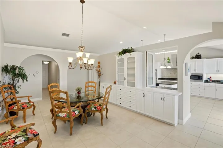 The kitchen opens to the adjoining Dining room with additional cabinetry.