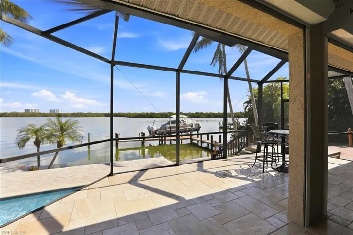 The expansive lanai spans across the back of the home, providing magnificent views of the bay.