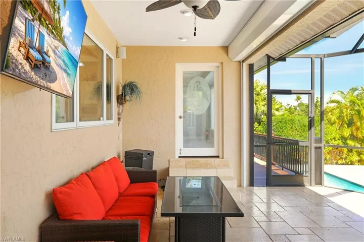 Screened lanai off the kitchen, along the back of the home.